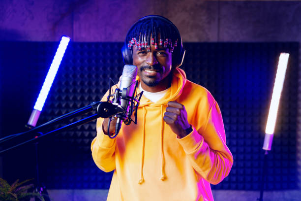istock Young African performer recording his new track in recording studio 1430587100