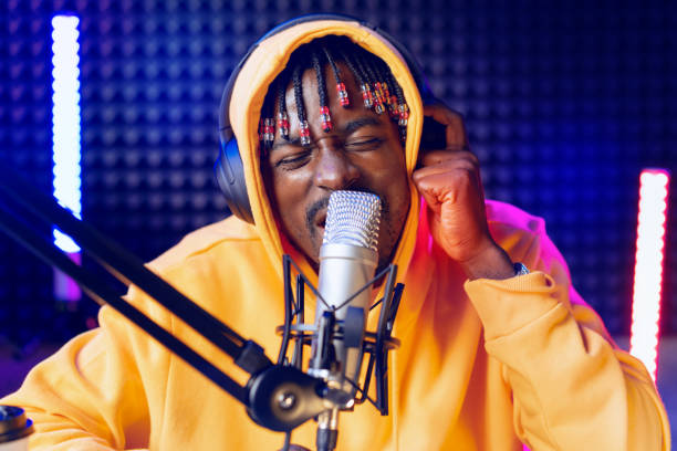 istock Young African performer recording his new track in recording studio 1430588333