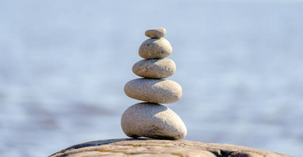 istock Pyramid of stones. Unstable balance of stone objects. 1430588413