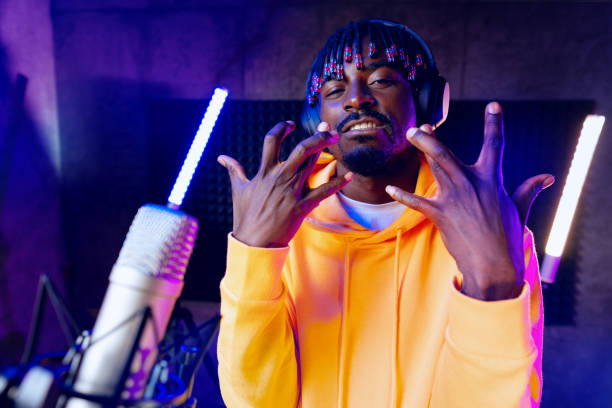 istock Young African performer recording his new track in recording studio 1430588432