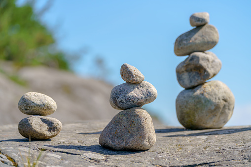 Pyramid of stones. Unstable balance of stone objects. Idyllic state of nature.