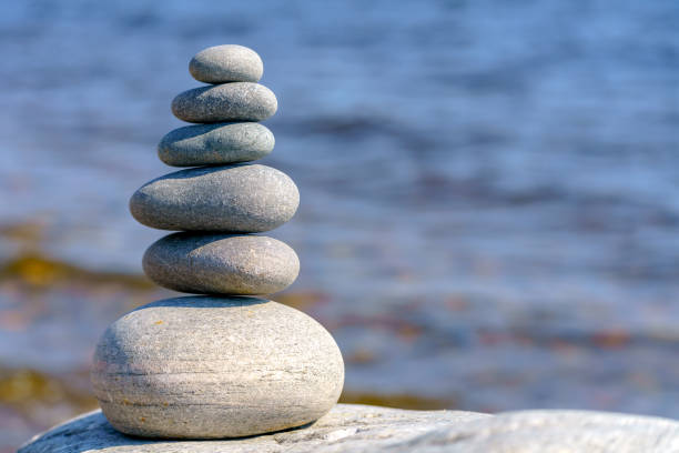 istock Pyramid of stones. Unstable balance of stone objects. 1430588575