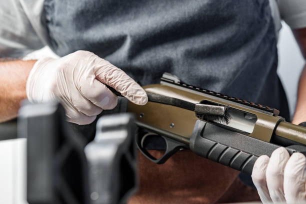 istock The gunsmith maintaining his rifle in a workshop 1430588939