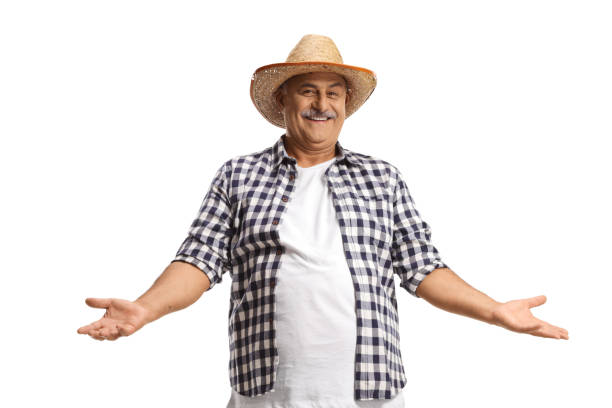Happy mature farmer with a straw hat gesturing with hands isolated on white background
