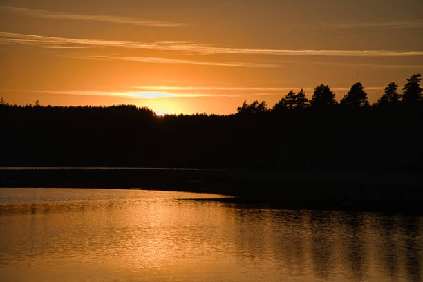 istock Sunset with reflection on a Swedish lake in Smalland. Romantic evening mood 1430591354