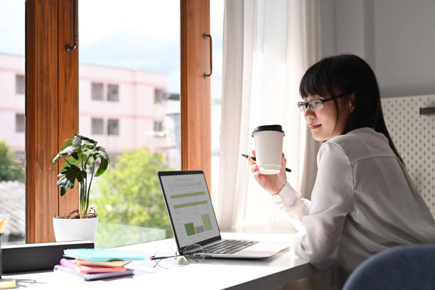 istock Asian businesswoman working with laptop computer and financial document at her workplace. 1430592500