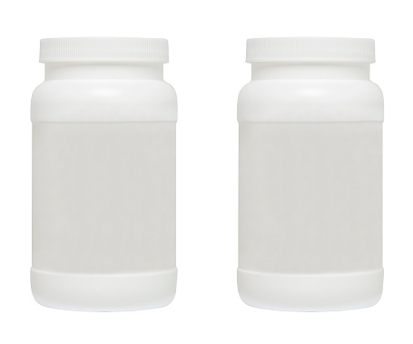 White medical containers on white background