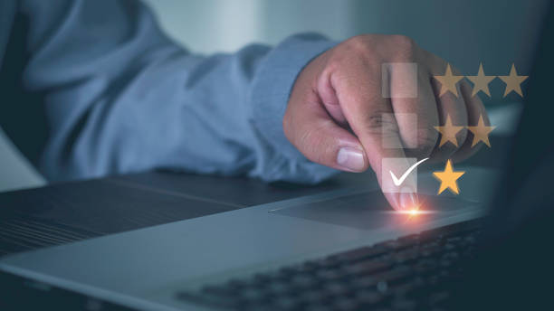 istock Businessman use laptop  score 1 virtual stars Satisfaction Assessment Survey Experience feedback business quality, service, service compliments. Best. Five-star rating. service rating Satisfaction Concept. 1430595723