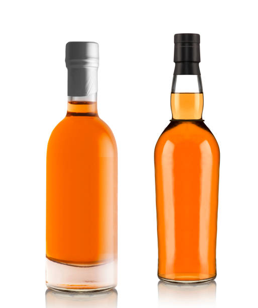 istock Full whiskey bottles isolated on white background 1430596003