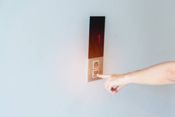 istock Hand finger press the Elevator button, woman waiting for Elevator in office or apartment 1430597074