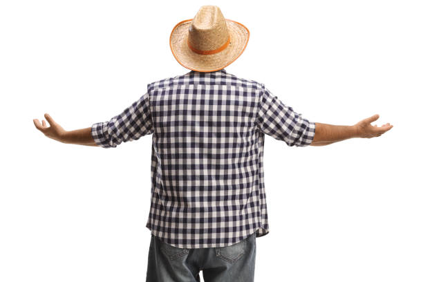 Rear view of a farmer with a straw hat gesturing with hands isolated on white background