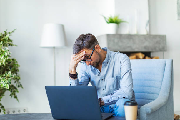 istock Young adult man online learning at home 1430599087