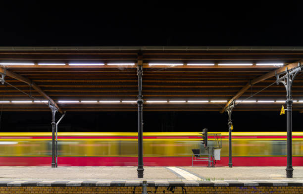 istock Blurred Motion Of Train Passing By Railroad Station Platform 1430605234