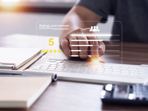 istock Man sending ratings and reviews with 5-star online on computer keyboard. 1430610995