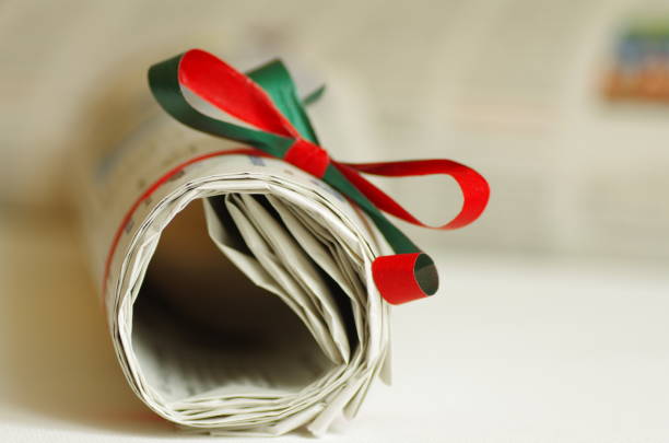 Daily newspaper as a gift with ribbon