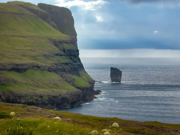 Photo of Risin og Kellingin (Giant and the Witch (or Hag)) sea stacks just off the northern coast of Eysturoy island, Faroe Islands, close to the town of EiÃ°i.