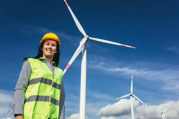 istock Female engineer on windmill farm for electric power production 1430614076
