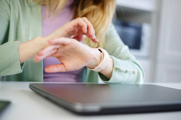 istock Woman using smart wrist watches. White female browsing notifications on modern smartwatch gadget. Person browse online message on portable wireless gadget 1430614792