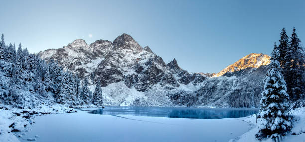 Winter landscape of sunrise in Tatra Mountains. stock photo