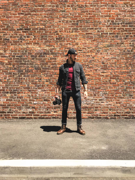istock casual photographer against the wall 1430621258