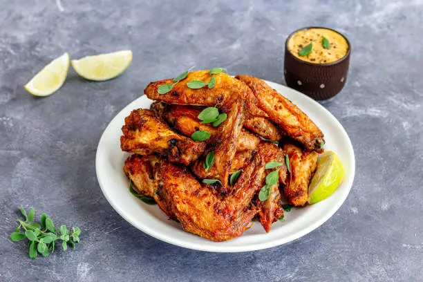 Air Fryer Chicken Wings with Dipping Sauce Close-Up Chicken Appetizer Photo
