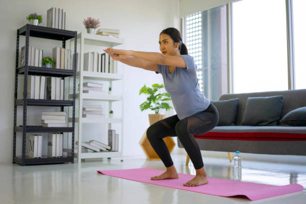 istock Young woman exercise at home. 1430625675