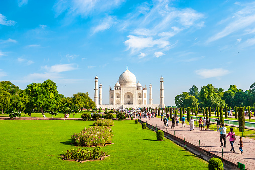 AGRA, INDIA - September 28, 2013: Amazing view on the Taj Mahal. The Taj Mahal is the best example of Mughal architecture, it attracts tourists from all over the world. Agra, Uttar Pradesh, India.