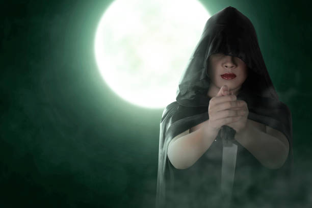 istock Asian witch woman with a cloak holding a knife 1430630066