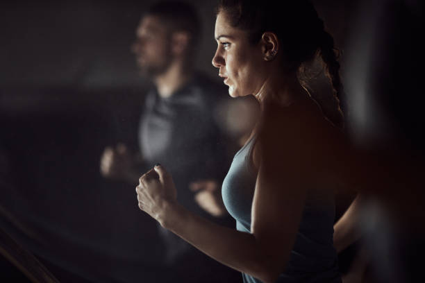 istock Athletic woman warming up in a gym. 1430631209