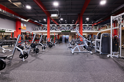 Gym without people with large group of exercise machines.