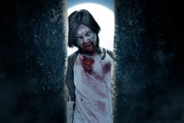 istock Scary zombie with blood and wound on his body standing 1430631739