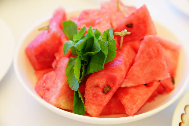 istock pieces of watermelon and mint on a plate. 1430632107