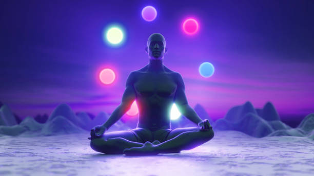 sylwetka człowieka o zachodzie słońca medytującego w pozycji lotosu. na skałach w blasku. kolorowe czakry. joga, zen, buddyzm, regeneracja, religia, zdrowie i dobre samopoczucie. renderowanie 3d - mantra zdjęcia i obrazy z banku zdjęć