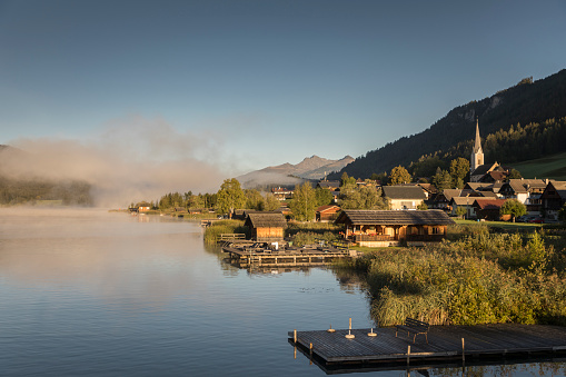 Scenic sunrise with some foggy areas in the little village of Techendorf at Lake Weissensee, Carinthia. The region is very famous in wintertime for ice skating and in summertime for hiking and mountainbiking.
Canon EOS 5D Mark IV, 1/500, f/4 , 41 mm.