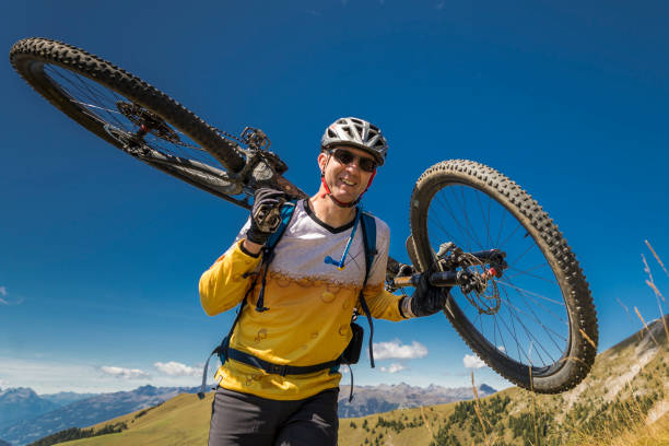 istock Have fun with mountainbike on shoulders. 1430639826
