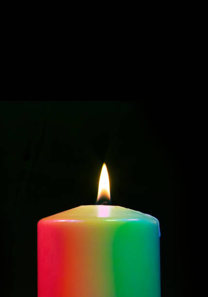 istock Candle with many colors burning 1430640115