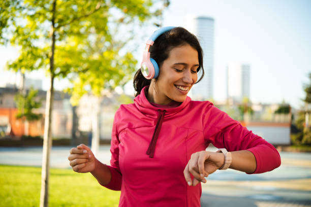 istock Portrait of a girl using smartwatch while running 1430643326