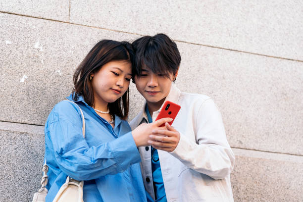 istock Happy Couple Using Phone 1430646289
