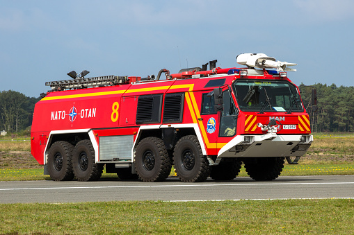 MAN airport crash tender fire truck on the tarmac of Kleine-Brogel NATO Air Base. Belgium - September 13, 2014