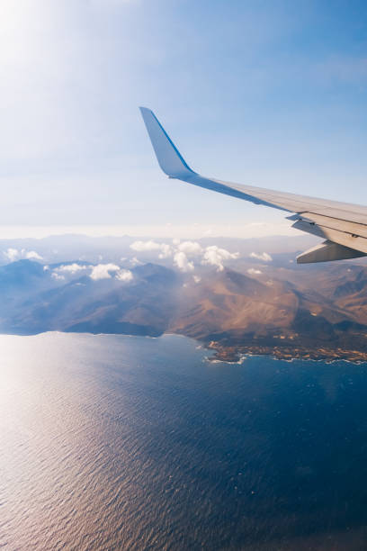 Airplane wing flying above Canary Islands