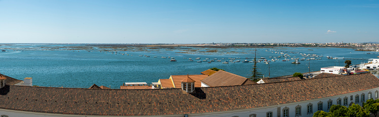 Faro, Portugal, September 2022: Panorama high angle view on the coastline of the city of Faro in Portugal.