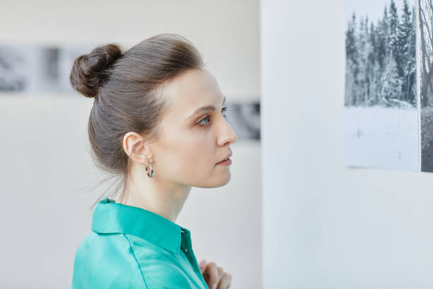 istock Young Woman Looking at Art 1430661910