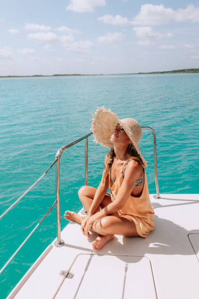 istock Young woman relaxing on a catamaran trip on a beautiful lagoon 1430663100