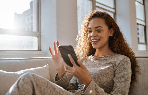 istock Phone, social media and relax with a woman writing a text message or doing a search using the internet in her home. Mobile, research and typing with a female online for communication or networking 1430670033