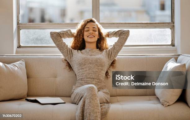 Black Woman Relax And Resting On Living Room Sofa On Holiday Vacation Or Break At Home Calm African Female Relaxing On Couch In South Africa Apartment For Relaxation And Stress Relief At The House Stock Photo - Download Image Now