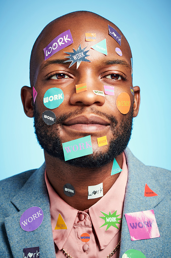Portrait of business man with stickers on his face, happy and smiling. Mock up for startup, entrepreneur and working at a new company. Businessman, marketing and working black with blue background