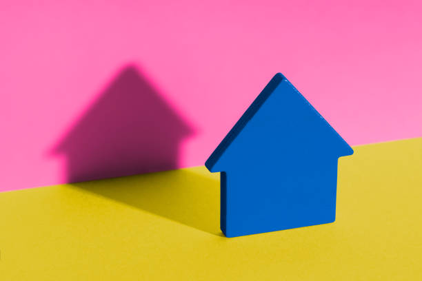 istock Wooden toy brick house symbol with shadow 1430670938