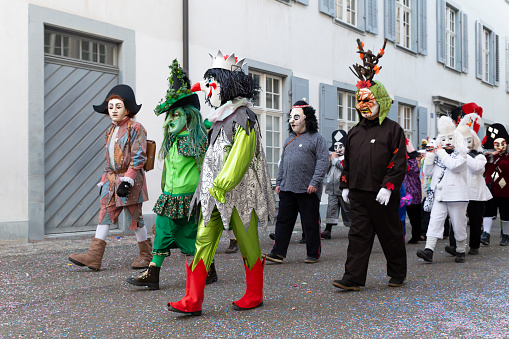 Switzerland, Basel, 8 March 2022. Small group of carnival participants in colorful costumes