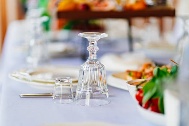 istock inverted glasses on the table. table setting for an outdoor holiday. 1430671398