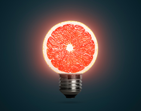 Fruit concept with grapefruit light bulb. This file is cleaned and retouched.